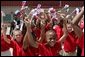 School children cheer during the arrival of Russian President Vladimir Putin at Hunter Army Airfield in Savannah, Ga., Tuesday, June 8, 2004. White House photo by Paul Morse