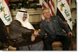 President George W. Bush shakes hands with new Iraqi President Ghazi al-Yawer at the G8 Summit on Sea Island, Ga., Wednesday, June 9, 2004.  White House photo by Eric Draper