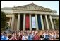 Thousands of people paid tribute to former President Ronald Reagan as they view his funeral procession along Constitution Avenue, Wednesday, June 9, 2004. White House photo by Joyce Naltchayan.