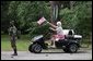 A women waves an American flag at the G8 Summit on Sea Island, Ga., Wednesday, June 9, 2004. White House photo by Eric Draper.