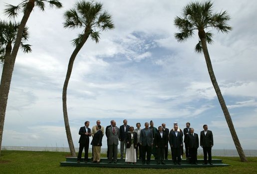 Leaders of G8 countries, European officials and guests pose at the beach for a group photo at the G8 Summit in Sea Island, Ga., Wednesday, June 9, 2004. White House photo by Eric Draper.