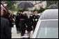 Former First Lady Nancy Reagan watches the casket of former President Ronald Reagan being loaded into a hearse at the funeral service at the National Cathedral in Washington, DC on June 11, 2004. White House photo by Paul Morse.