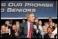 President George W. Bush makes a point during a conversation on Medicare-approved prescription drug discount cards in Liberty, Mo., June 14, 2004. White House photo by Susan Sterner