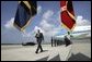  President George W. Bush walks past a military honor guard after arriving aboard Air Force One at MacDill Air Force Base in Tampa, Florida, Wednesday, June 16, 2004. White House photo by Eric Draper.