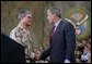 President George W. Bush greets Lieutenant General Lance Smith, Commander Central Command, before delivering remarks to military personnel at MacDill Air Force Base in Tampa, Florida, Wednesday, June 16, 2004. White House photo by Eric Draper.