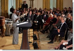 Dione Taylor sings with the Billy Taylor Trio as part of a reception for Black Music Month held in the East Room of the White House on June 22, 2004.   White House photo by Paul Morse