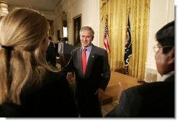 President George W. Bush greets small business owners after delivering remarks on the economy in the East Room, Friday, July 2, 2004.  White House photo by Eric Draper