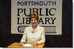 Laura Bush answers reporters questions after participating in the No Child Left Behind Summer Reading Program with local children at the Portsmouth Public Library in Portsmouth, New Hampshire, Friday, July 9, 2004.  White House photo by Yoni Brook