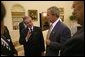 President George W. Bush and Prime Minister Abdullah Badawi of Malaysia meet in the Oval Office Monday, July 19, 2004. Also pictured are National Security Advisor Dr. Condoleezza Rice, left and Secretary of State Colin Powell. White House photo by Tina Hager.