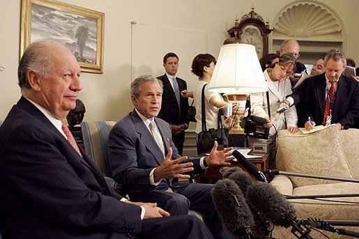 President George W. Bush and President Ricardo Lagos of Chile meet in the Oval Office Monday, July 19, 2004. "One of the things that has worked well is the free trade agreement with Chile, and we talked about that today," said President Bush. White House photo by Paul Morse.