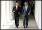 President George W. Bush and President Ricardo Lagos of Chile walk together along the colonnade at the White House Monday, July 19, 2004. White House photo by Paul Morse.