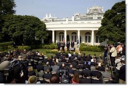 Standing with, from left, Vice President Dick Cheney, Secretary of Health and Human Services Tommy Thompson and Secretary of Homeland Security Tom Ridge, President George W. Bush delivers remarks during the signing ceremony of S.15-Project Bioshield Act of 2004, in the Rose Garden Wednesday, July 21, 2004.  White House photo by Paul Morse