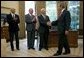 President George W. Bush welcomes Apollo 11 Astronauts Michael Collins, left, Neil Armstrong, center, and Buzz Aldrin to the Oval Office Wednesday, July 21, 2004. The astronauts visited the White House to mark the 35th anniversary of the successful Apollo 11 mission of landing on the moon, walking along its surface and safely returning home White House photo by Eric Draper.