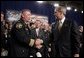 President George W. Bush greets firemen after remarks on homeland security at Northeastern Illinois Public Training Academy in Glenview, Illinois on Thursday July 22, 2004. White House photo by Paul Morse.