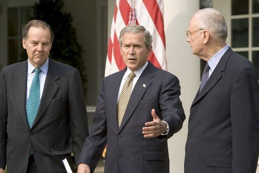 Accompanied by Chairman Thomas Kean, left, and Vice Chairman Lee Hamilton of the 911 Commission, President George W. Bush addresses the press during the presentation of the Commission's report in the Rose Garden Thursday, July 22, 2004. White House photo by Eric Draper.