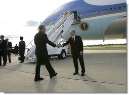 President George W. Bush meets with Freedom Corps Greeter Eric Rasmussen at Detroit Metropolitan Wayne County Airport, Friday, July 23, 2004. Mr. Rasmussen, a volunteer with the Tax Assistance Program at the Volunteer Accounting Service Team of Michigan, is the 300th USA Freedom Corps Greeter since the President began greeting outstanding volunteers in communities across America in March 2002. White House photo by Eric Draper.