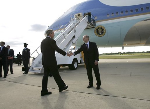 President George W. Bush meets with Freedom Corps Greeter Eric Rasmussen at Detroit Metropolitan Wayne County Airport, Friday, July 23, 2004. Mr. Rasmussen, a volunteer with the Tax Assistance Program at the Volunteer Accounting Service Team of Michigan, is the 300th USA Freedom Corps Greeter since the President began greeting outstanding volunteers in communities across America in March 2002. White House photo by Eric Draper