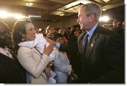 President George W. Bush meets with audience members after addressing the National Urban League Conference in Detroit, Mich., Friday, July 23, 2004.  White House photo by Eric Draper