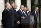 Standing with members of his national security team, President George W. Bush discusses America's intelligence reforms in the Rose Garden Monday, Aug. 2, 2004. White House photo by Paul Morse.