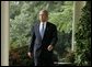 President George W. Bush enters the Rose Garden where he talks about America's intelligence reforms Monday, Aug. 2, 2004. White House photo by Paul Morse.