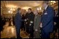 President George W. Bush greets military personnel after signing H.R.4613, The Defense Appropriations Act for Fiscal Year 2005, in the Dwight D. Eisenhower Executive Office Building Thursday, Aug. 5, 2004. White House photo by Eric Draper