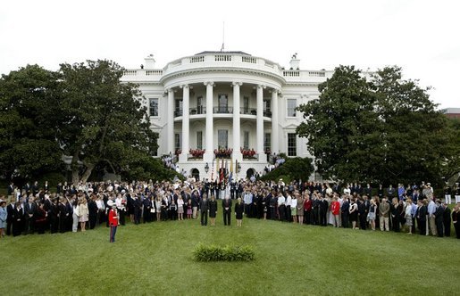 President George W. Bush, Mrs. Bush, Vice President Dick Cheney and Mrs. Cheney, center, are joined by White House staff and families of victims of 911 for a Moment of Silence on the South Lawn at 8:46am, Saturday, Sept. 11, 2004. White House photo by Tina Hager.