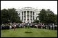 President George W. Bush, Mrs. Bush, Vice President Dick Cheney and Mrs. Cheney, center, are joined by White House staff and families of victims of 911 for a Moment of Silence on the South Lawn at 8:46am, Saturday, Sept. 11, 2004. White House photo by Tina Hager.