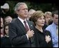 President George W. Bush and Mrs. Bush pause during the playing of Taps following the Moment of Silence on the South Lawn, Saturday, Sept. 11, 2004. White House photo by Eric Draper.