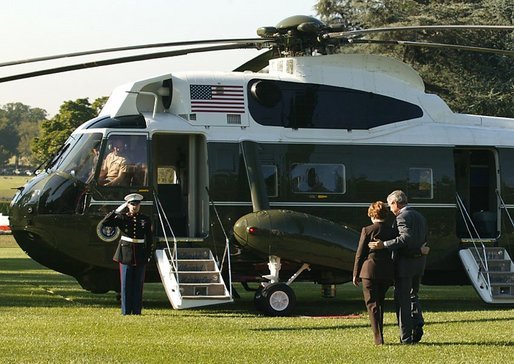 President George W. Bush and Laura Bush depart the South Lawn en route to Andrews Air Force Base, Friday, Sept. 10, 2004. White House photo by Joyce Naltchayan.