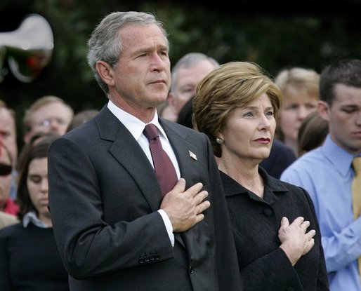 President George W. Bush and Mrs. Bush pause during the playing of Taps following the Moment of Silence on the South Lawn, Saturday, Sept. 11, 2004. White House photo by Eric Draper