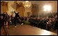 President George W. Bush and Laura Bush watch the performance of Joaquin Cortes as he dances to a quintet of Flamenco musicians during a Hispanic Heritage Month celebration in the East Room of the White House Wednesday, Sept. 15, 2004. White House photo by Joyce Naltchayan