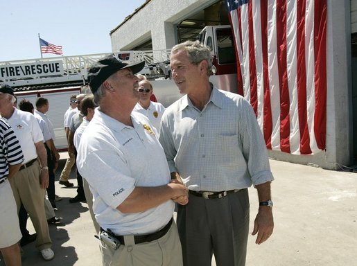 President George W. Bush greets Arthur Bourne, Police Chief of Gulf Shores, during a visit with First Responders at the Orange Beach Fire and Rescue Station 1 in Orange Beach, Alabama Sunday, Sept. 19, 2004. White House photo by Eric Draper