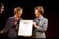 Laura Bush presents Kathleen "Kathy" Keen with a certificate honoring her as the national Preserve America History Teacher of the Year at the New York Historical Society in New York, Oct. 19, 2004. White House photo by Joyce Naltchayan