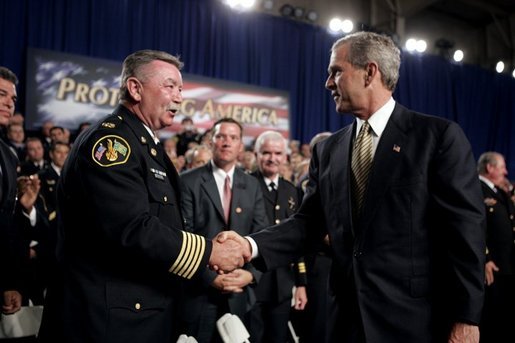 President George W. Bush greets firemen after remarks on homeland security at Northeastern Illinois Public Training Academy in Glenview, Illinois on Thursday July 22, 2004. White House photo by Paul Morse