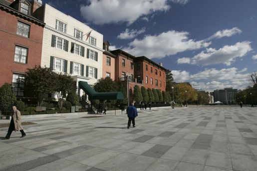 Pedestrians stroll across Pennsylvania Avenue in front of the Blair House after a brief ceremony by Laura Bush, in which she opened Pennsylvania Avenue's walkways as a permanent pedestrian park Tuesday, Nov. 9. 2004. White House photo by Paul Morse.