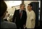 President George W. Bush talks with U.S. Army Spc. Kenneth Lukes of Fort Atkinson, Iowa, during a visit to Walter Reed Army Medical Center in Washington, D.C., Tuesday, Nov. 9, 2004. White House photo by Eric Draper.