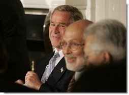 President George W. Bush attends the Iftaar Dinner with Ambassadors and Muslim Leaders in the State Dining Room of the White House, Nov. 10, 2004. White House photo by Paul Morse