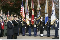 President George W. Bush salutes the playing of the national anthem during a wreath laying ceremony at the Tomb of the Unknowns on Veterans Day Thursday, Nov. 11, 2004. "Today we also recall the men and women who did not live to be called "veterans," many of whom rest in these hills. Our veterans remember the faces and voices of fallen comrades. The families of the lost carry a burden of grief that time will lighten, but never lift," said the President in his remarks. White House photo by Paul Morse