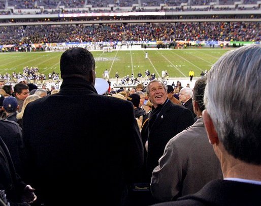 President George W. Bush looks up into the stands at Lincoln Financial Field during the 2004 Army/Navy football game in Philadelphia, Pa., Dec. 4, 2004. White House photo by Tina Hager