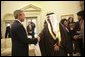 President George W. Bush shakes hands with interim Iraqi President Ghazi Al-Yawer at the end of their meeting in the Oval, Monday, Dec. 6, 2004. White House photo by Eric Draper