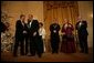 President George W. Bush greets Warren Beatty during a reception for the Kennedy Center Honors in the East Room of the White House, Sunday, Dec. 5, 2004. Also pictured, from left, are honorees Ossie Davis, Ruby Dee, Elton John, Joan Sutherland, and John Williams. White House photo by Eric Draper