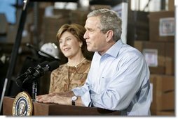 President George W. Bush and Laura Bush visit Operation USO CarePackage at Fort Belvior, Va., Friday, Dec. 10, 2004. "This is one way of saying, America appreciates your service to freedom and peace and our security," said the President in his remarks about the program that has delivered more than 480,000 care packages.  White House photo by Paul Morse