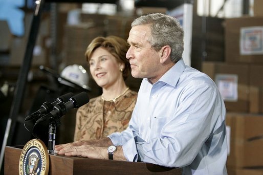 President George W. Bush and Laura Bush visit Operation USO CarePackage at Fort Belvior, Va., Friday, Dec. 10, 2004. "This is one way of saying, America appreciates your service to freedom and peace and our security," said the President in his remarks about the program that has delivered more than 480,000 care packages. White House photo by Paul Morse