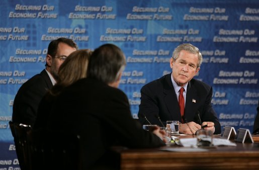 President George W. Bush listens as Liz Ann Sonders, chief investment strategist at the Charles Schwab & Co., speaks during a White House economic conference at the Ronald Reagan Building and International Trade Center in Washington, D.C., Thursday, Dec. 16, 2004. Also pictured are William Roper, dean at the School of Medicine at the University of North Carolina, Chapel Hill, right, and James Glassman, Senior economist at JP Morgan Chase, left. White House photo by Paul Morse