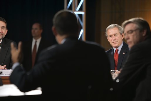 President George W. Bush listens to Time Warner CEO Richard Parsons, center, during a White House economic conference at the Ronald Reagan Building and International Trade Center in Washington, D.C., Thursday, Dec. 16, 2004. Also pictured are, James Glassman, Senior economist at JP Morgan Chase, far left, and former Rep. Tim Penny, D-Minn, right. White House photo by Paul Morse