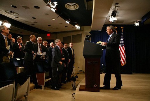 President George W. Bush arrives at a press conference in room 450 of the Eisenhower Executive Office Building on December 20, 2004. White House photo by Paul Morse.