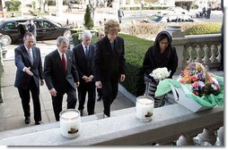 Laura Bush approaches a candle-lit memorial honoring the victims of the recent tsunami at the Embassy of Indonesia during a visit with President George W. Bush and former Presidents Bush and Clinton in Washington, D.C., Monday, Jan. 3, 2005.  White House photo by Susan Sterner