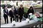 Laura Bush approaches a candle-lit memorial honoring the victims of the recent tsunami at the Embassy of Indonesia during a visit with President George W. Bush and former Presidents Bush and Clinton in Washington, D.C., Monday, Jan. 3, 2005. White House photo by Susan Sterner.