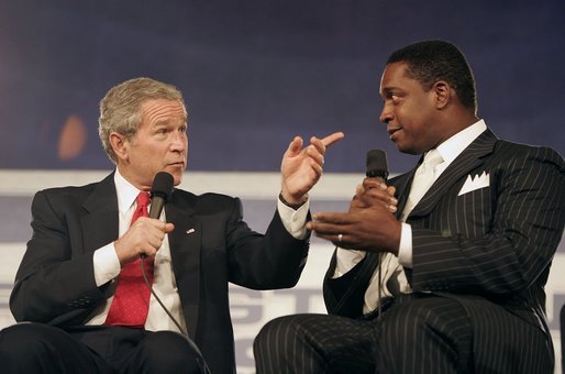 President George W. Bush talks with Bob McFadden during a discussion about Social Security reform at the Andrew W. Mellon Auditorium in Washington, D.C., Jan. 11, 2005. "I know that if we don't address the problem now, it will only get worse with time," President Bush said. "And I believe there is a fundamental duty, for those of us who have been given the honor of serving the American people, to solve problems before they become acute, and not to pass them on to future Presidents and future generations." White House photo by Paul Morse.