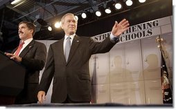 President George W. Bush is introduced by Mel Riddle, principal of J.E.B. Stuart High School in Falls Church, VA before giving remarks on high school initiatives on January 12, 2005.  White House photo by Paul Morse